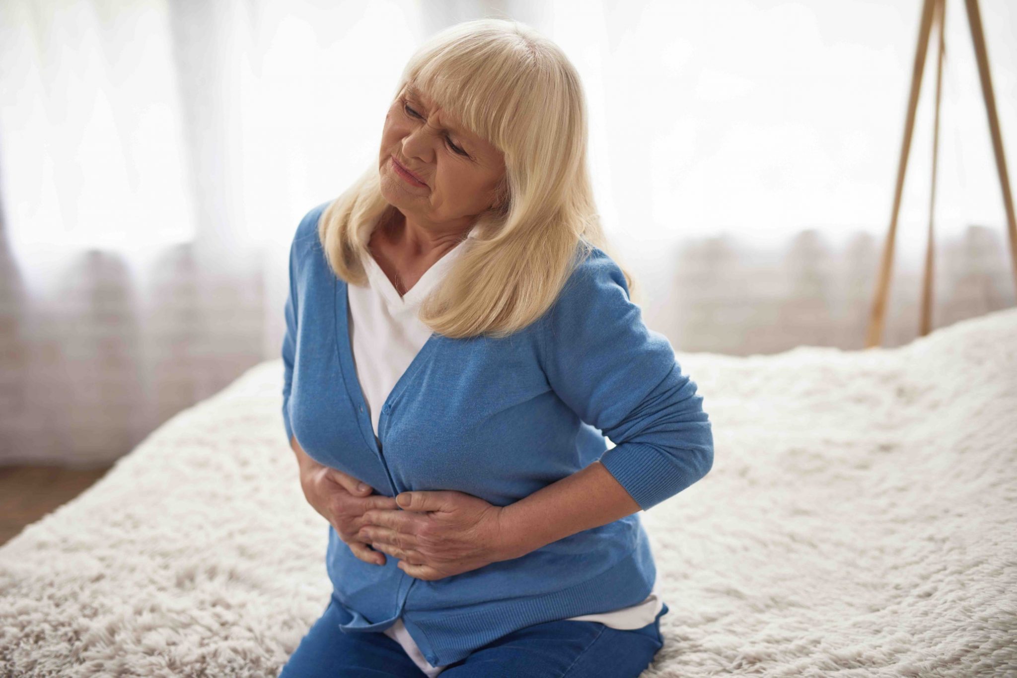 Senior Woman Holding Belly Morning Stomach Ache.